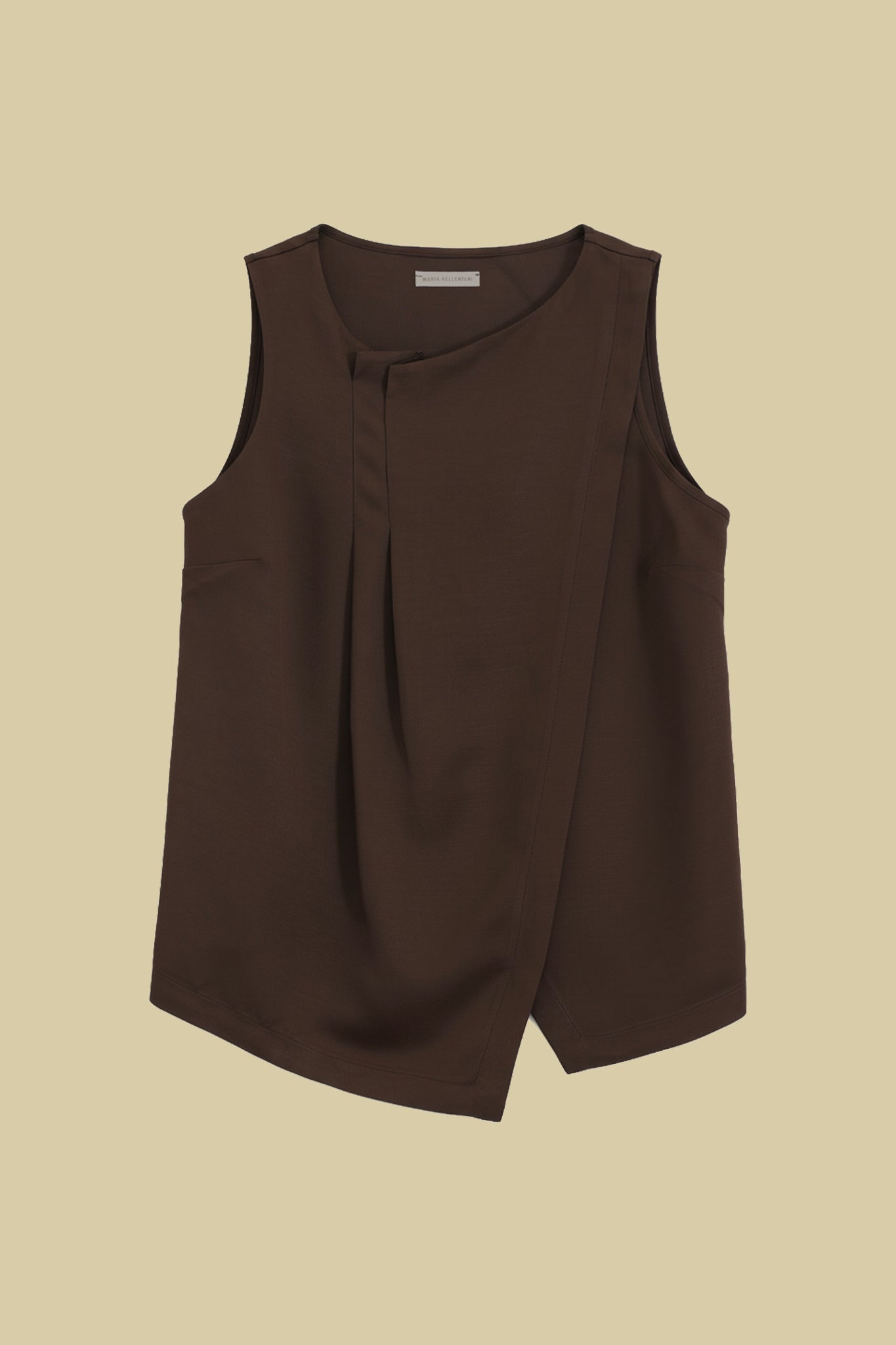 Sleeveless top with asymmetrical pleats