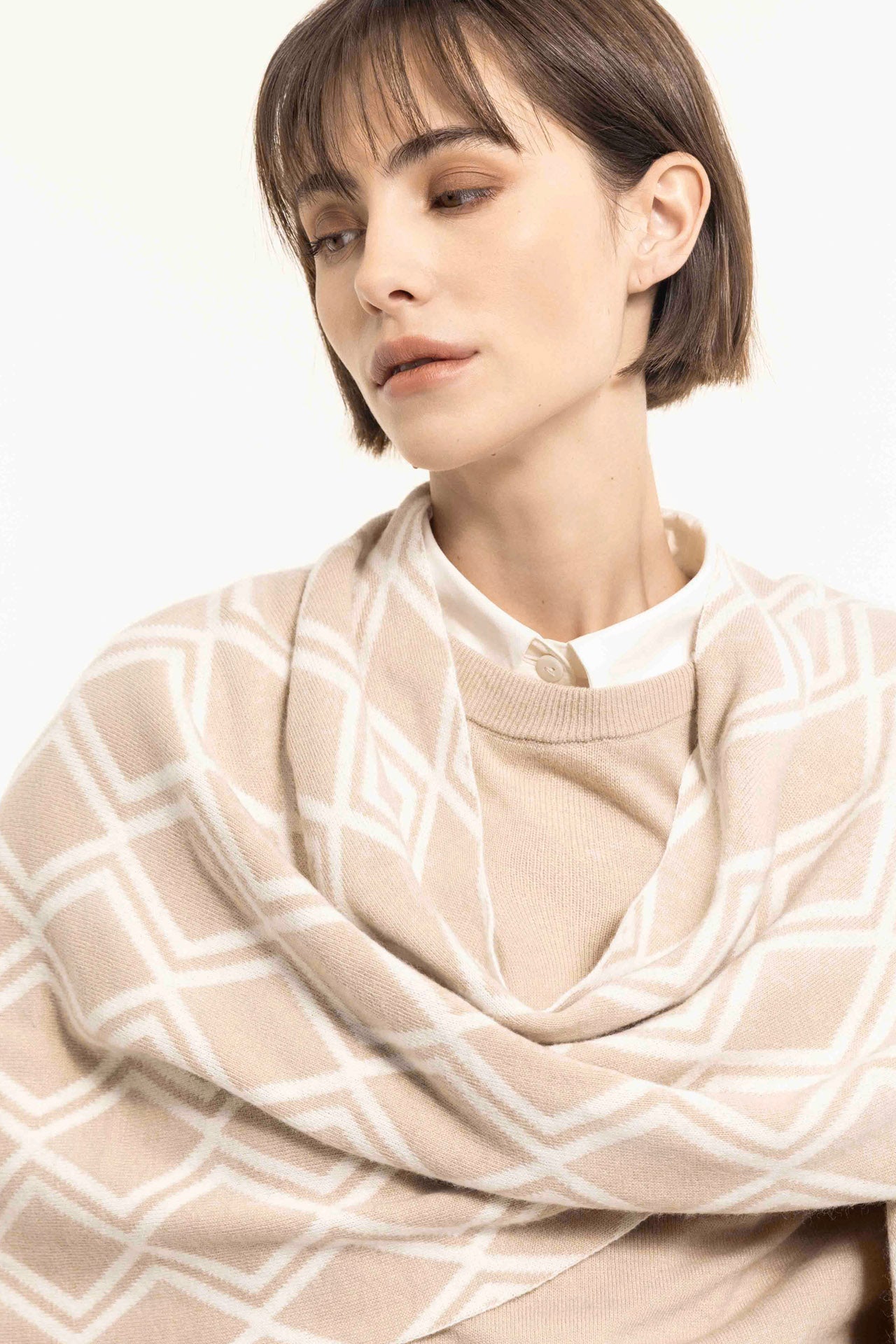 Beige wool blend jacquard cape with geometric pattern