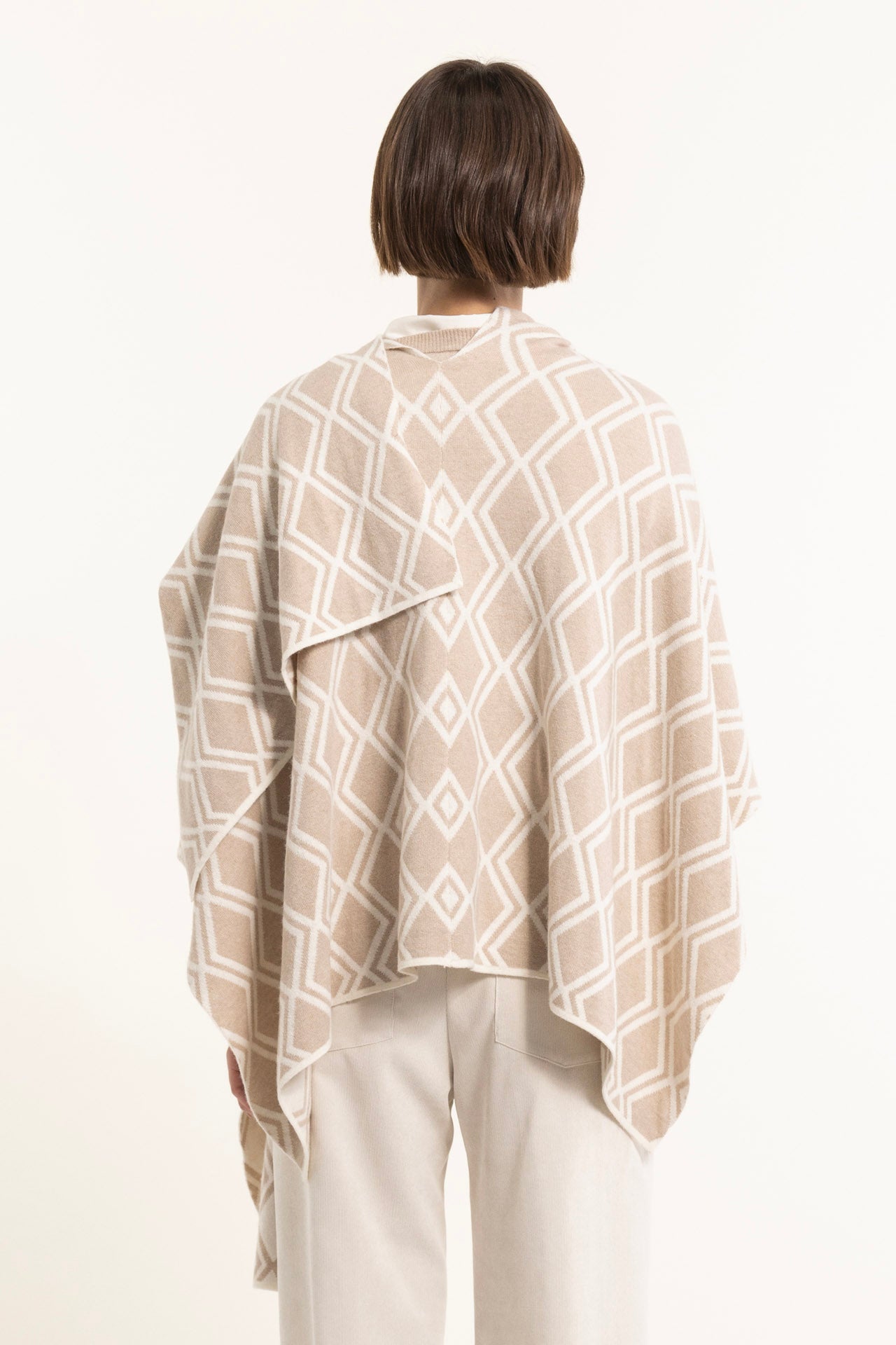 Beige wool blend jacquard cape with geometric pattern