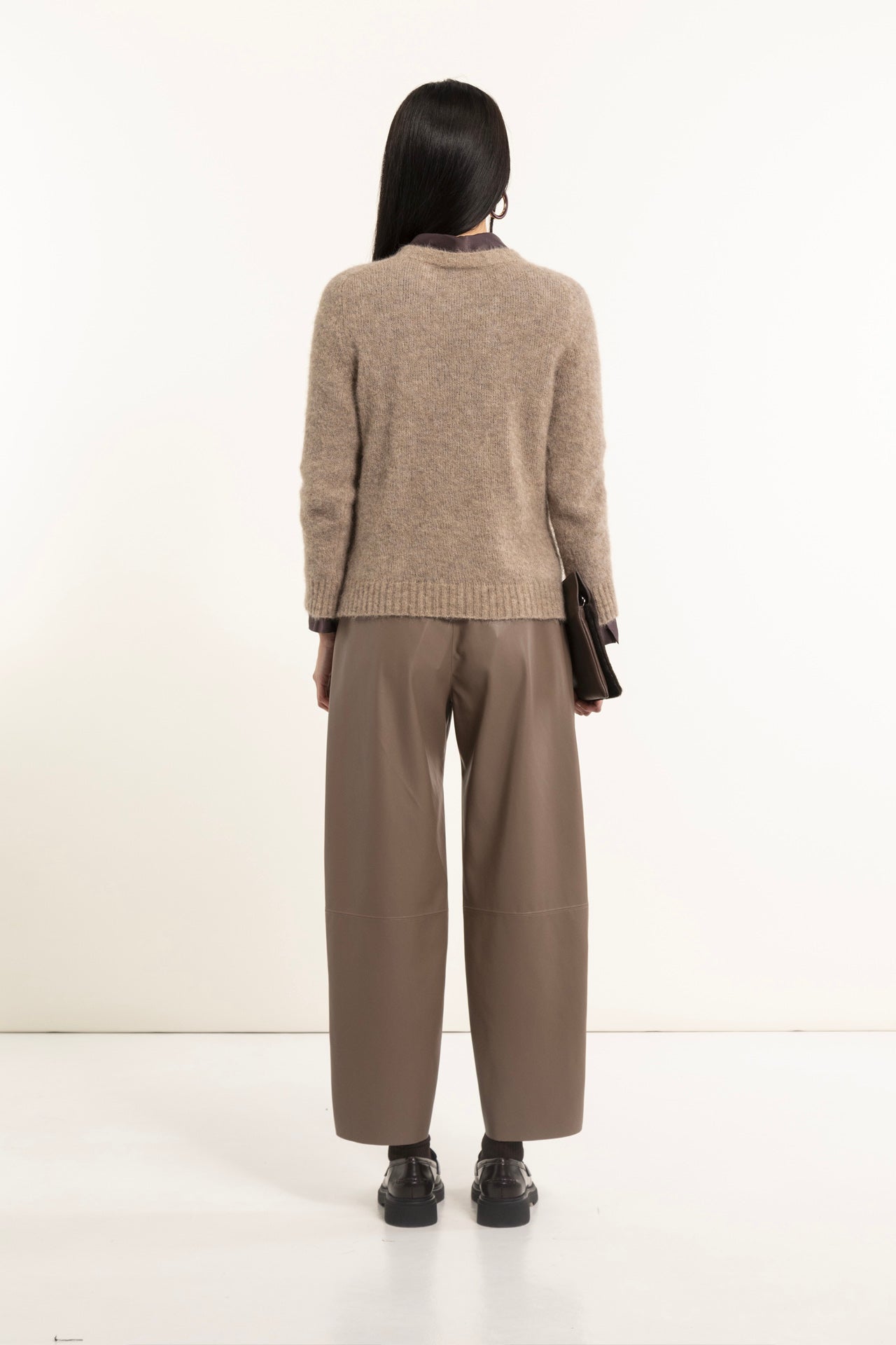 Beige faux leather barrel trousers with stitching
