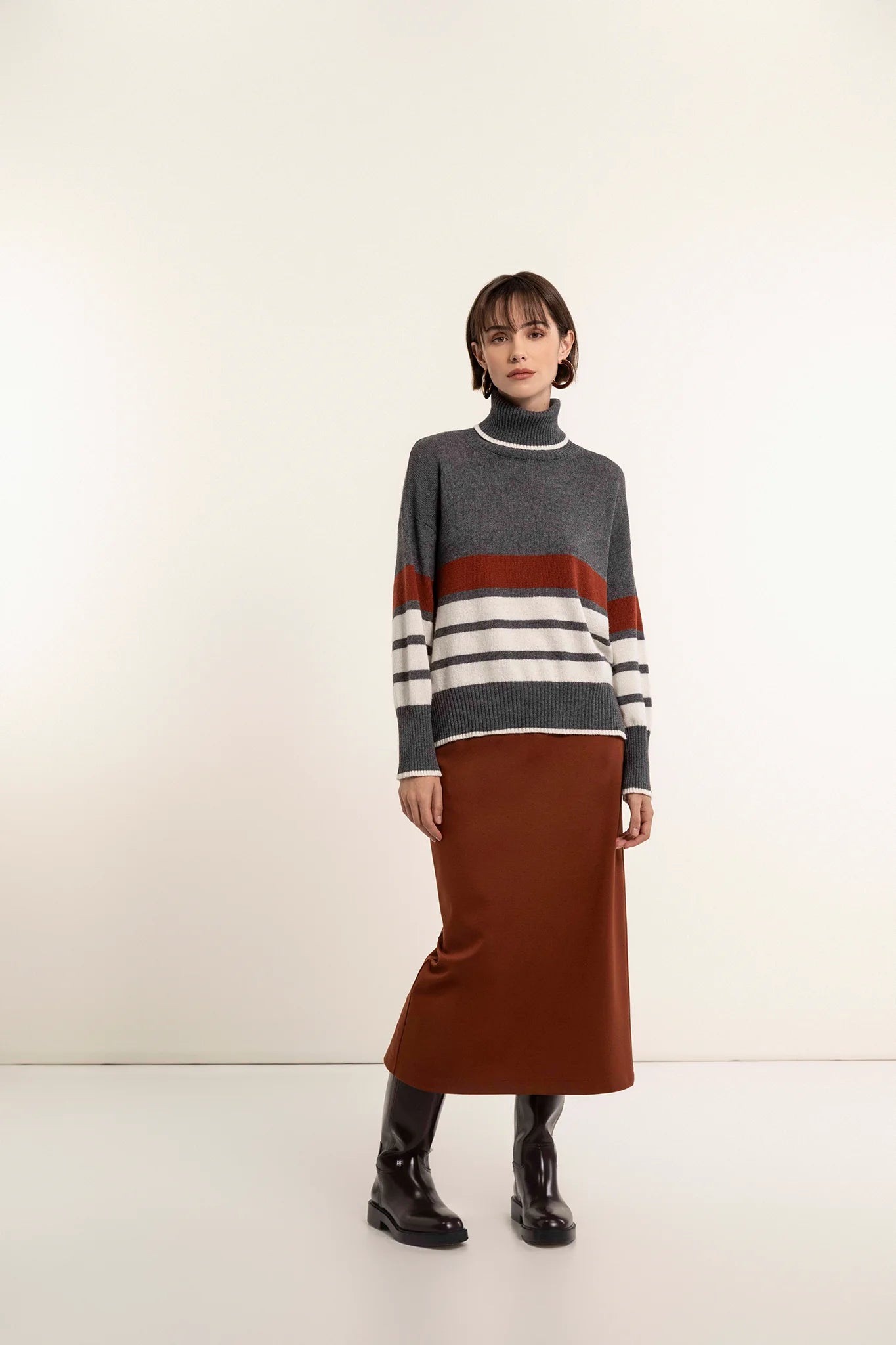 Turtleneck sweater with a mix of tricolor stripes